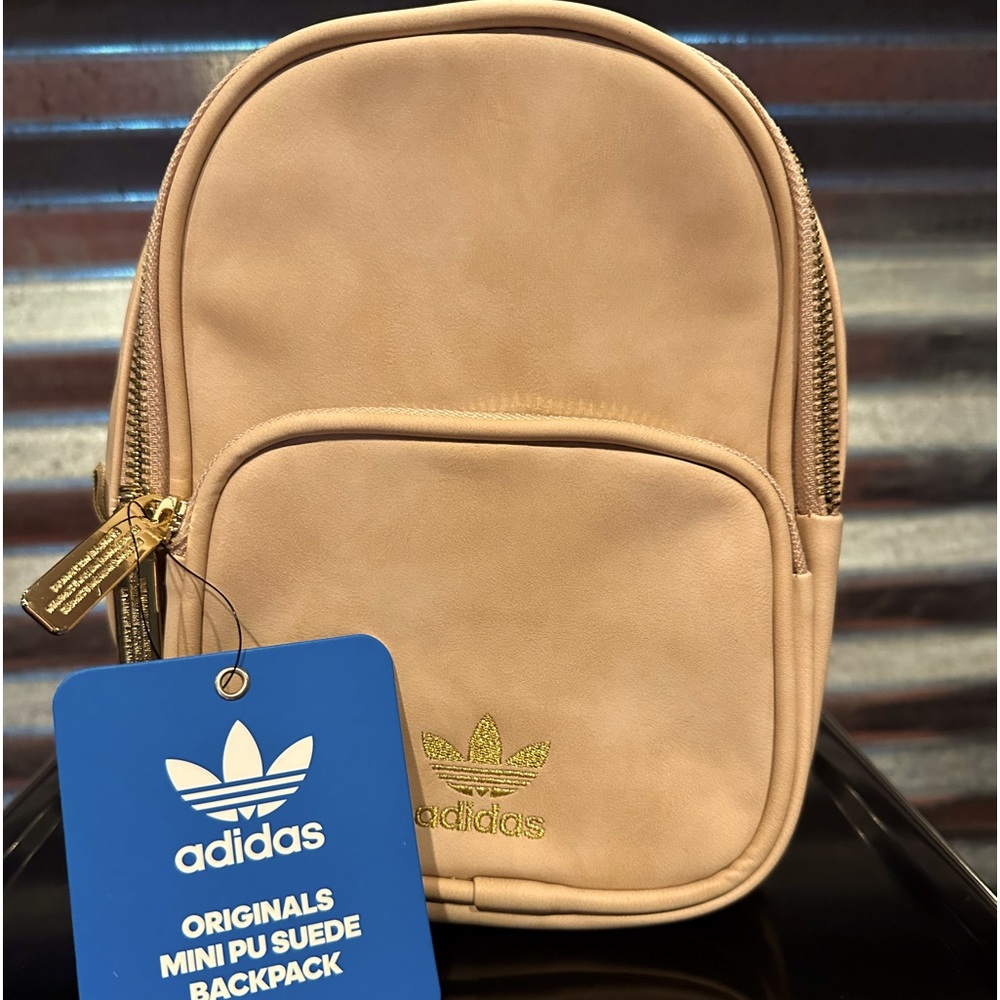 Light pink suede adidas original mini back pack.